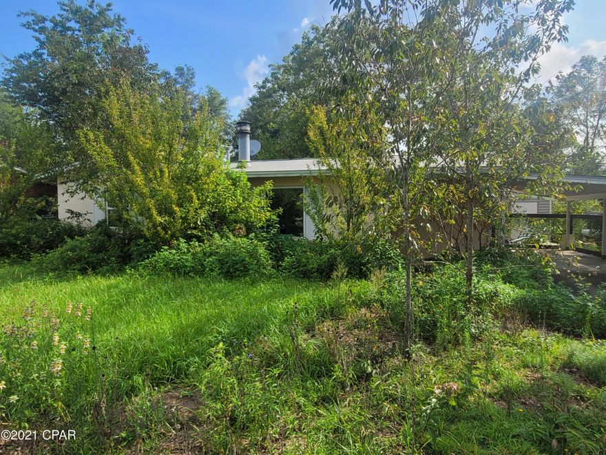 Perfect starter or retirement home in Sunny Hills. Homes has open living with wood burning stove and dining area. Kitchen has plenty of storage, laundry area.  2 spacious bedrooms and full bath. Carport for parking. Fenced in yard. Outbuilding for additional storage. Several fishing spots in the area. Not far from Boat Lake for seasonal swimming.