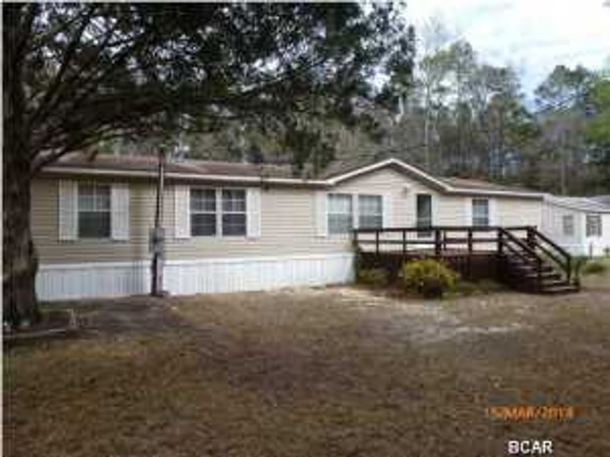 Priced to Sell!! Grab it before it is gone!!This is country living at its best! This well kept and very spacious 2002 double-wide sits on four lots totaling a half acre just 800' off of Hwy 231 south of Fountain. The house shows pride of ownership and you'll be glad you didn't let this one get away. This home features a large living room with wood burning fireplace, a formal dining room, a large kitchen w/ breakfast bar, oversized bedrooms with walk-in closets, a large master bath with garden tub and separate shower and and inside laundry room. All appliances are included. The well and well pump and A/C unit were all replaced in 2008. There also is a yard building to hold all your extras and in the front there is a nice deck for relaxing. Easy commute to Panama City. Seller will provide