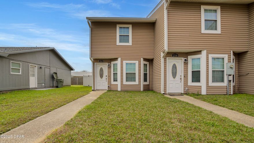 FURNISHED 2 bedroom, 1.5 bath townhome in Lynn Haven! Walking distance to Publix, Starbucks, Waffle House and much more! There are 2 bedrooms (carpet) and a full bathroom (ceramic tile) upstairs. Main level features all ceramic tile with a living room, dining area, 1/2 bath, and laundry. The kitchen features custom cabinets, granite counter tops, and stainless steel appliances. There is a screened patio overlooking the fenced backyard. 2 parking spaces in front of the unit.  Lawn maintenance included.