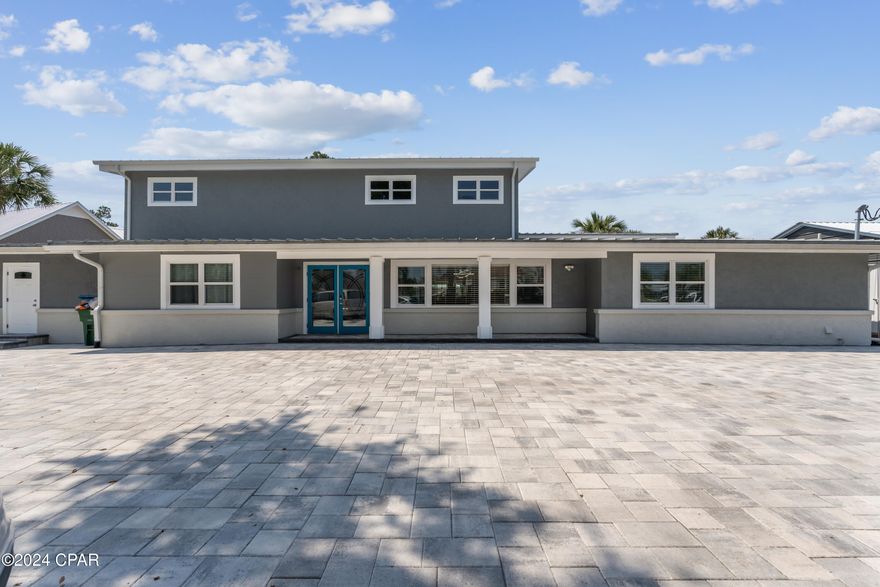 NO HOA! Approved for short term rentals! 
Owner financing!
One of a kind waterfront mansion constructed of cinder-block, poured concrete and steel I-beams, it sits on a .49 acre waterfront lot in Panama City Beach Florida. 
Home is located at the mouth of a deep water canal literally on the bay with spectacular views of the bay and the Hathaway bridge. This home is a boater's dream! It has it's own boat ramp in the back yard! Dock has 4 boat slips, 2 large slips for 40'+- boat (one 10K lbs. boat lift) and two smaller slips.  Approx 9210 sqft under roof with 5125 square feet of  heated and cooled living space, 7 bedrooms and 6 full bathrooms, 2 gorgeous  large kitchens. New roof in 2020/23 new AC in 2017 and 2023, updated electrical and plumbing, 25X45 concrete patio attached to the boat-house, 5 of 6 baths renovated, a custom floating staircase, open concept living, and a indoor 40k Gallon salt water pool are just a few of the amazing features of this one of a kind home. No HOA! This home is perfect for short term rentals, event venue or for large families. The upstairs can be used as a separate 2 bedroom apartment/mother-in-law suite. Add your finishing touches and make this home yours! This is an ''As is'' sale.... Bring all offers!
Do not let this one get away!

Starting 1 March 2025 the home will be available for short term rental. 

May consider long term lease with agreeable terms.
