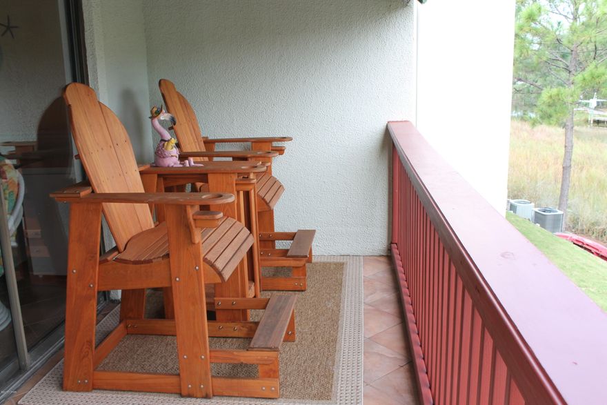 Waterfront on Grand Lagoon with boat dock and Gulf access. Be in the Bay and the Gulf in 20-30 minutes. Owners can have an HOA approved pet. This gated community is only a block from the beach. You will enjoy this beautiful condo immediately because it's ready to go and needs nothing. Look at the pictures...you won't be disappointed. This a great place to live full-time or to have as a second home. Either way you will have your own piece of paradise. This condo has way above average storage.