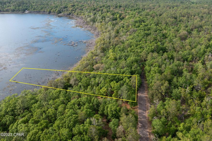 Ready for your dream home? This waterfront lot is peacefully located in the gated community of Leisure Lakes. Ownership in this neighborhood gives you access to the pool which overlooks the ''large lake'', beach area for swimming, tennis/basketball court, exercise room, restrooms and a pavilion with grills. This community is located approximately 25 minutes north of Panama City and a short drive to the ''Worlds most beautiful beaches''.