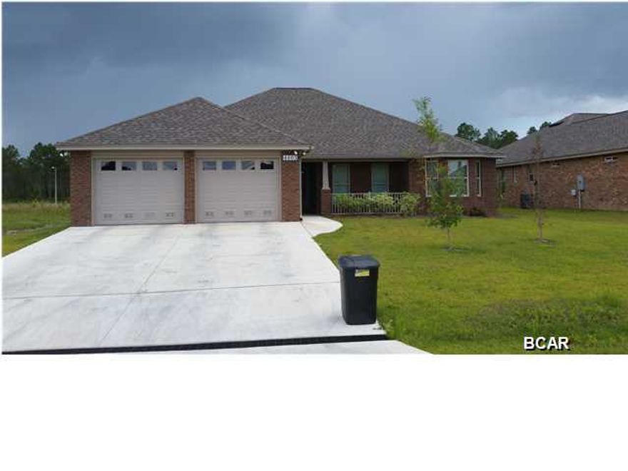 Minutes From Mall This Fine Built Home by locally renowned builder is 3 bedroom 2 bath all brick home that offers master bath with his & hers double shower with Rain maker (3 shower heads) and shower seats on both ends, and walk in closet. The kitchen is a dream with all wood cabinets, solid surface countertops, and stainless steel appliances. There are cabinets in the laundry room. Living room with and electric fire place and crown molding and formal dining room. Home comes with a security system and generator ready electrical outlet with cord. Outdoors there is an enclosed screen patio, outside shower and sprinkler system. Home is built to 140 MPH wind code. Located at Bylsma Manor Estates with many homes already built and waiting for you to tour today. Ask about No Money Down.