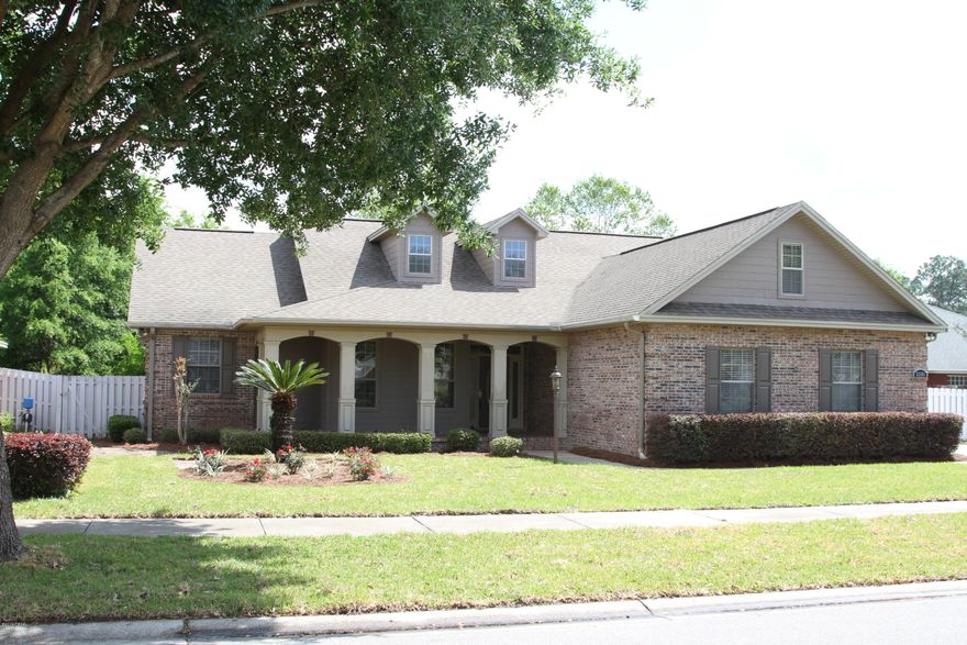 HOUSE IS BACK ON THE MARKET!!!  Look no further than this beautiful custom built home in the Hammocks.  It has everything a family could possibly dream of with a split floor plan, both breakfast and formal dining rooms, large family room with gas fireplace, large Master bedroom & bath as well as upstairs 30'x 12' bonus room for kids or home office.  Fourth bedroom can also be used for multi-use bonus room or home office.  French doors lead off the living/family room to a quiet screened in porch off the back of the house which in turn connects to the covered patio, making it perfect for cookouts.  There are 10' ceilings throughout the house with crown molding and chair rails to match.  All new hardwood floors throughout the house with new carpet in all the bedrooms. Inside of house has been completely repainted.  Kitchen has new stove and dishwasher as well as new faucet and sink to go along with newly refaced kitchen cabinets.  Many, many extras.  Your clients must see this house.  Carved columns in dining room and fireplace mantel to match.  Front yard has been just been sodded giving the house a fresh street appeal look that will have heads turning.  The one of a kind front porch is perfect to end those hard days relaxing with a cool beverage of your choice.  If square footage and room sizes are important to your buyer please have them verified.  Seller is providing ERA AHS Home Warranty to purchaser of the property.