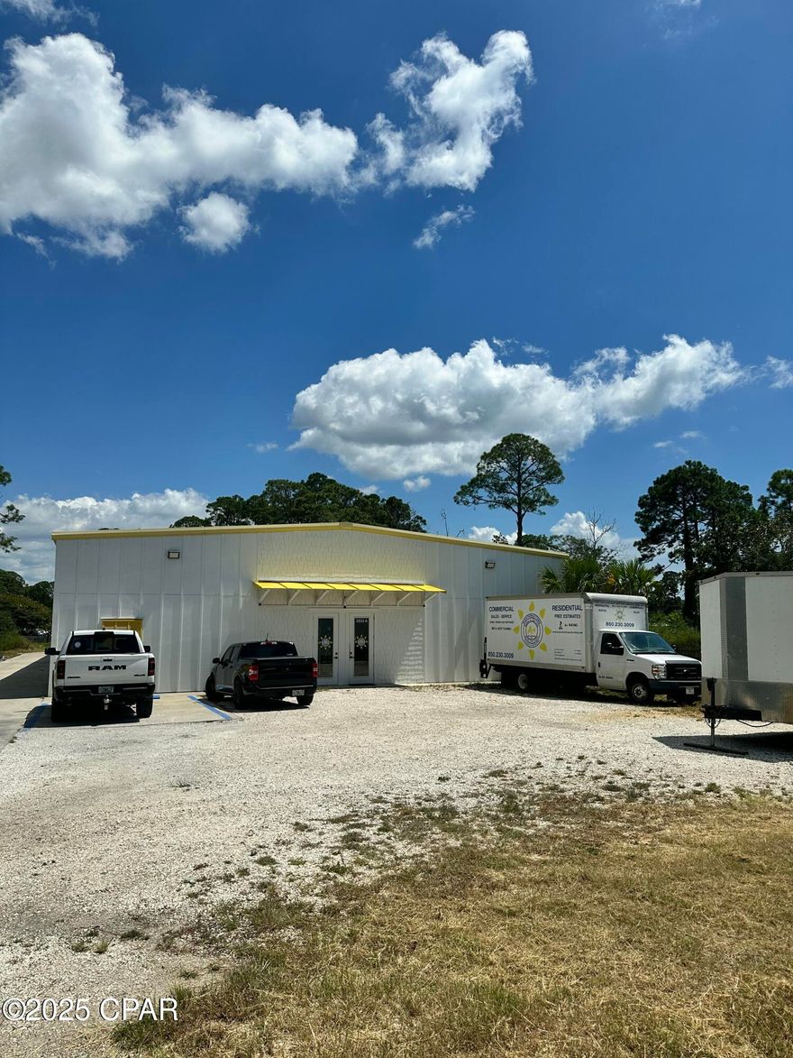 Call today for a showing of this 9000SF warehouse, an excellent opportunity for investors or owner-occupants! The property is conveniently located on Joan Ave in Panama City Beach. It includes 750 SF office space, featuring two executive offices, a large foyer, a conference room and two bathrooms. There's mezzanine storage with a low beam height of 13'7 feet, extending to 16'11 feet  at eve. The building can also be adjusted to create 6 individual 1500 SF baya or various combinations. Built in 2022, it is designed to endure wind speeds of up to 140 mph. The nearly one acre site provide ample parking and open areas for additional parking or equipment.