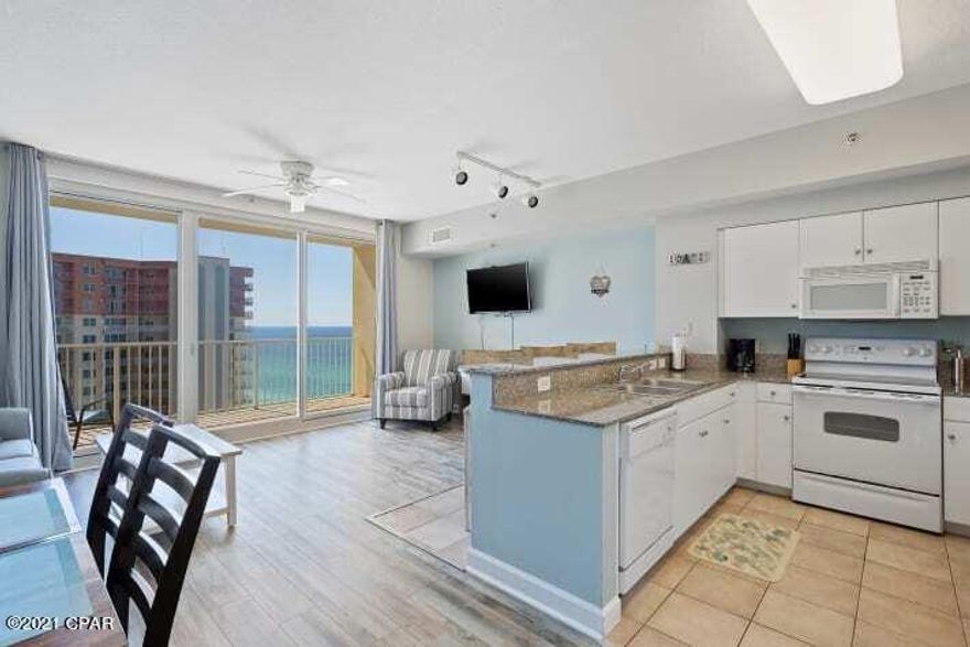 With light and airy decor, this beautifully decorated beachfront condo is complete with everything you need for a turnkey vacation rental.  Assigned parking included. Completely updated with fresh new paint and new furniture that comfortably sleeps 6! The private balcony not only overlooks the beautiful lagoon pool and tiki bars, but has amazing views of the Gulf.  King Master  a flat screen TV, and a private en suite bathroom with a shower/tub. The bunk room has new twin mattresses (which are great for kids or adults) and its own full bathroom attached! New paint, queen sleeper sofa, and furniture, new mattresses, new patio dining table and chairs!  Vinyl Plank flooring! Excellent location on the beach, next to Pineapple Willys! State of the art fitness center 2 tiki bars, indoor pool pool and hot-tub, outdoor gulf side hot tub.  Shores of Panama is the best rental income generator on the beach.  Its popularity has resulted in great yearly income for many owners. This rental has made $26,000 just in the last 3 months.