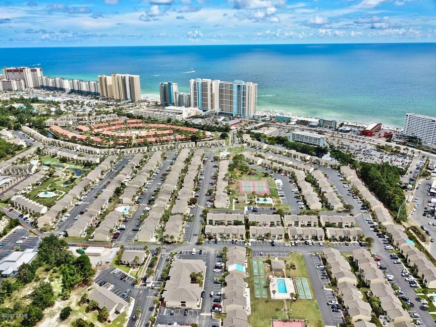 Very nice Glass Back unit located on the canal. Great location with very little drive by traffic.  Unit has an on demand Hot water heater. Tile floors downstairs.  Practically new carpet upstairs.  Has been very well kept with only a few rentals.  2 deeded parking spaces in front of the unit.  Complex is gated, with 11 swimming pools.  One on the Gulf behind the restaurant. 4 tennis courts, shuffle board courts and 2 acre miniature golf course.  Wide streets great for walking, jogging rollerblading or just riding around in your golf cart.  Very quiet, but close to the beach.  Very family oriented complex