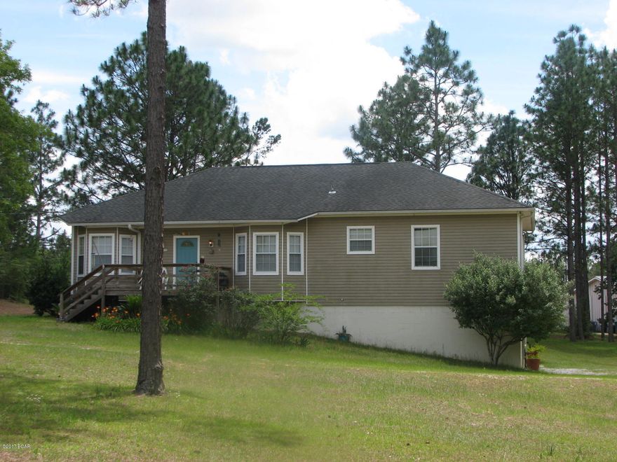 Beautiful home on 1.53 acres w/ access to Compass Lake in the Hills amenities. Enter the front door to a tiled foyer & large open living room featuring hardwood floors & a bay window w/ beautiful pine trim offering plenty of natural lighting. The eat-in kitchen is spacious w/ wood cabinets, black & stainless appliances & tiled floor. There is also a formal dining room. The master bedroom features a bay window with pine trim also. There is a double vanity in the master bathroom & a jacuzzi tub. The second bathroom also has a double vanity w/ plenty of cabinet storage. There is a nearly finished basement that has a bedroom, a full bathroom, laundry room, (435 sq ft) & living or recreation room(470 sq ft). Basement leads to 2 car garage and has inside stairs leading to the main home