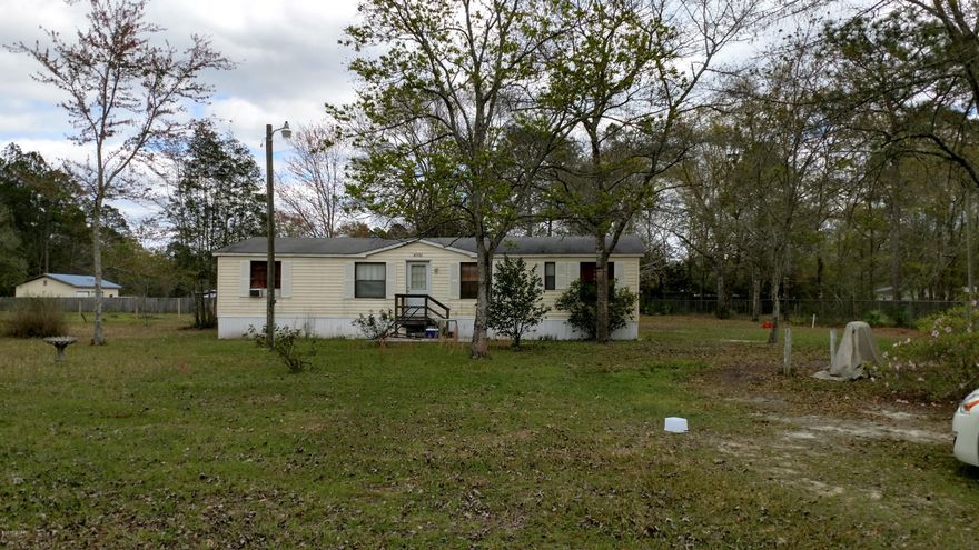 THIS IS A FABULOUS OPPORTUNITY TO HAVE OVER 1 ACRE (1.14 ACRES) WITH A DOUBLE WIDE MOBILE HOME. THE PARCEL HAS TWO SEPTIC TANKS AND TWO POWER POLES WHICH WILL ALLOW YOU TO PUT AN ADDITIONAL MOBILE HOME ON THE LOT. THIS PROPERTY IS LOCATED IN A NICE QUIT NEIGHBORHOOD AND IS PRICED TO SELL QUICKLY.