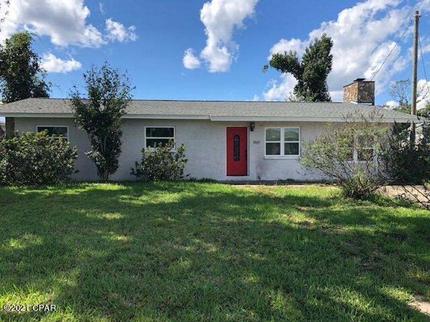 IMPROVED PRICE! This 3 bedroom, 2 1/2  bath home is located in the heart of Lynn Haven, and walking distance to the new Cain Griffin Outdoor Sports Complex. The neighborhood is situated close to schools, shopping and restaurants. Entering from the front door there is a large entry and space for a dining or living area. A connecting large living room has a cozy fireplace to enjoy on cool evenings, The spacious home also has a large kitchen and an extra den which could be used as a play room or man cave. There is also an addition adjacent to this room with a 1/2 bath with a tankless hot water heater which would be ideal to be used as a home office, master bedroom or storage room.  So many possibilities are available in this home. A new roof was put on in 2019, and the HVAC is approx 3 years old according to the seller. The home has a large laundry room for extra storage also. The house is located on an oversized lot with  pumelo and satsuma fruit trees. There is a fence in the back yard, but the yard extends beyond the fence. There is a termite Bond with Brock Pest Control  which is transferrable.  
All sizes are approximate, buyer to verify if important.