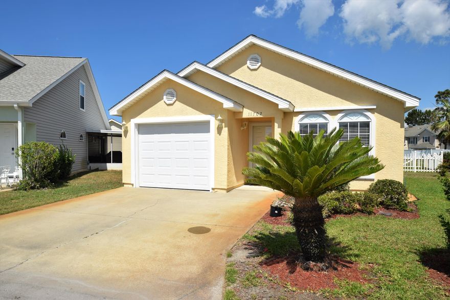 Very well maintained two Bedroom two Bathroom beach home in the Palm Cove subdivision on 1 1/2 Lots.This home offers Custom shelving and Clear View storm shutters. Great location. Close to Beach, Restaurants and Shopping. Palm Cove offers two pools one heated and the grounds are maintained by the Association. The enclosed Florida room adds extra value, and is a perfect area for entertaining or just relaxing . It over looks a natural area and a small yard. The Florida room has been enclosed with Glass windows and has ceramic tile for the flooring. Adding value as well as extra space. The back yard has vinyl fencing. This is a must see home