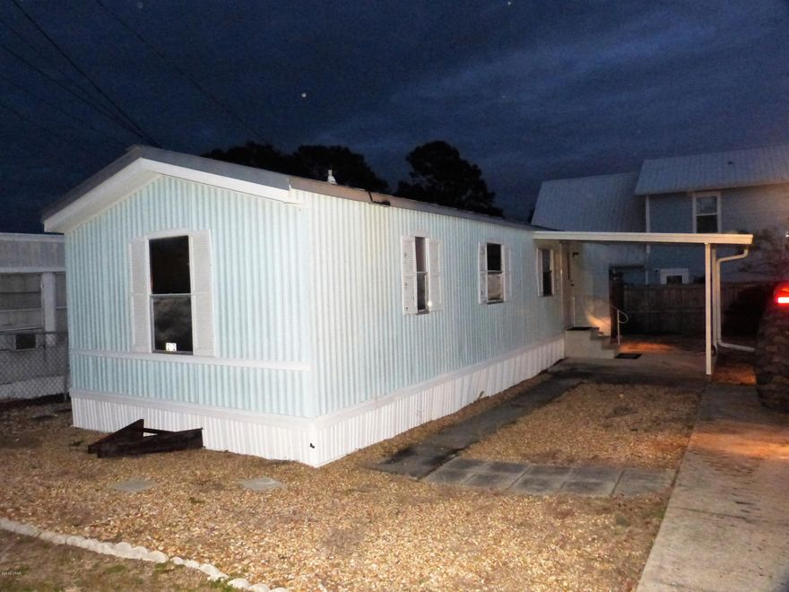 Here is a sweet one, we offer financing for this property type, so bring all buyers, no ''cash only'' limits.  Sweet furnished mobile home with view from lot to Gulf of Mexico and in popular Laguna Beach!  Golf cart friendly community on the Dedicated Beach zone!  There are a few items in this two bedroom one full and one half  baths home that are to be removed, if important inquire, just bring your suit cases and move in, selling ready to go!  Save your energy for beach fun, its just a little over a block to the white sand and Gulf!  Dolphins and sunsets are forever yours!   Additional features, metal roof, outside enclosed shower, backyard shed, easy maintenance free living, straight shot to the beach, golf cart neighborhood and close to Thomas Donuts and Carousel!  Call today!