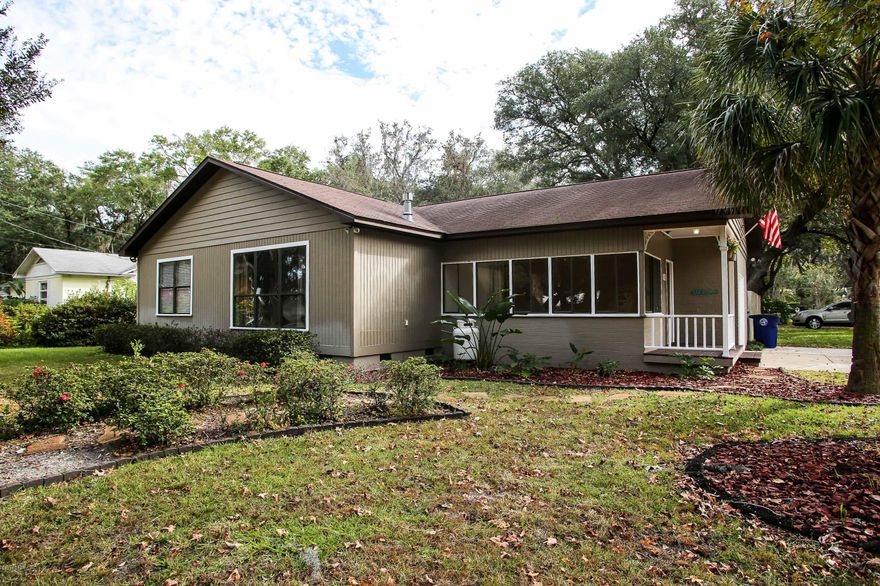 The lovely Cove home has the character that you expect in the neighborhood  with a modern touch you will enjoy!  This 4 bedroom, 2 bath home offers a lovely Florida room as you enter the home.  There is an open kitchen with stainless steel appliances, slate flagstone flooring and quartz counter tops.  The cabinets are newer and you will love the little peek of the original brick wall that is exposed.  The rest of the house has the original hardwood floors that were completely renewed about 4 years ago. The kitchen is open to both the eat in area as well as the living room.  The living room has a lovely gas fireplace with two matching built ins on either side.  The 60'' flatscreen television mounted over the fireplace will remain in the home as well as the sound bar that is already wired. Off the formal dining area there is a small bedroom that would also make a fabulous home office or home gym.  Down the hallway you will find 3 bedrooms and 2 full bathrooms, including the very spacious master bedroom with a large walk in closet and full bath.  Step out the back door onto a covered porch with porch swing and a walkway that will lead you out to a workshop.   There is additional parking in the backyard that would hold any size boat or motor home.   The back yard is completely fenced with a wood privacy fence and is shaded with large oak trees.  There is also a very special tree planted near the front door.  The tree produces oranges, limes, lemons, grapefruit and tangarines on one tree...its name is "Fruit Loop".

Home has a home warranty, termite bond and all the paperwork is there for all of the updated plumbing and the service for the air conditioning unit.