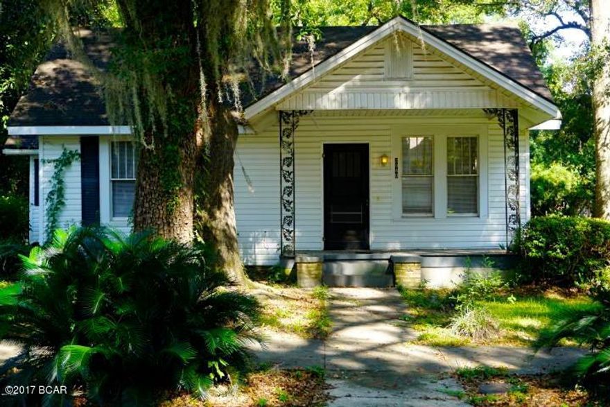 Nice 2 bedroom, 1 full bathroom home with additional office or bonus room that could be used as a bedroom (but doesn't have a closet).  This home has original hardwood flooring, newly painted throughout, updated kitchen cabinets, nearly 9'' ceilings, and loads of character! It conveys with a refrigerator & stove, 2 lots and a large storage building that is fully insulated as a music room.  Great location right downtown Marianna, FL.