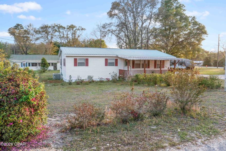 Cozy country living with room to spread out--this 2 bedroom, 2 bath home sits on a spacious parcel and offers a great mix of comfort and potential. Inside, you'll find a functional layout with a comfortable living area, open kitchen with ample cabinet space, and nicely sized bedrooms. The home features two full bathrooms, making it ideal for everyday living or accommodating guests. Step outside and enjoy everything this property has to offer. A screened-in porch provides a great spot to relax, while multiple outbuildings--including a detached shed/workshop and a carport--offer plenty of storage and workspace. There's also a separate small structure on the property that could be used as a guest space, office, or hobby area with a little vision. The yard offers a mix of open space and shade, giving you room for gardening, pets, or simply enjoying the outdoors. Whether you're looking for a primary home, investment opportunity, or a place to make your own, this property offers flexibility and value.