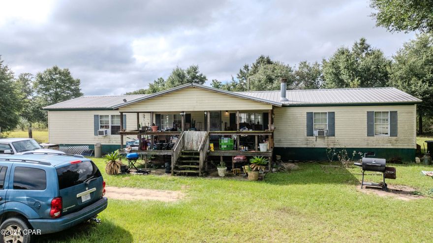 Welcome to 10012 Owenwood Rd in Fountain. This 3 bedroom, 2 bath manufactured home offers 1,976 sq. ft. of living space and was built in 1999. The home features an open floor plan with a split bedroom layout and sits on 5 acres in a quiet, private setting. Located about 40 minutes from Panama City Beach, the property provides plenty of room for gardening, animals, or future improvements.
