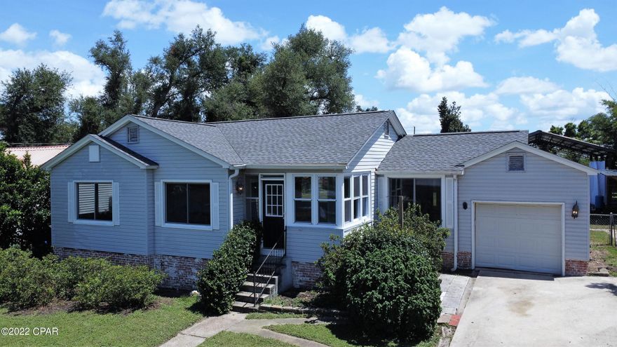 Open House on Sunday, 8/21 from 1-4pm! WATER VIEWS IN THE COVE!  This charming 3 bedroom, 1 bath home features original hardwood flooring, a large yard, 1-car garage, and 24'x32' pole barn with back alley access through the double gate of the privacy fence!  Located in prime spot in the Cove, this home is a short walk to the marina and a local coffee shop!  All of the major systems are newer in this home including roof (6 yrs old), HVAC unit (2 yrs old), irrigation jet well pump (2 yrs old), pole barn (2 yrs old), privacy fencing (1 yr old), and tankless water heater (3 yrs old).  There's even raised planter beds in the back yard ready for your garden!  Don't miss out on this one!