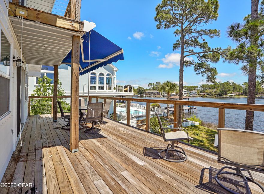 Welcome to S Lagoon waterfront living, where investment potential, lifestyle, and flexibility come together in one beautifully updated 3-in-1 property, Pontoon conveys. Positioned directly on the water with two boat slips and a boat lift, this rare opportunity is ideal for boating enthusiasts, short-term or long-term rental income, multi-generational living, the ultimate house hacking.

The main upstairs furnished dwelling features 3 bedrooms, 2.5 baths, and a spacious three-quarter wraparound balcony designed to capture breezes, water views, and the relaxed coastal lifestyle. The property has been completely updated and remodeled, offering peace of mind with all new modern interior design in 2020, Hardie board exterior in 2022, plus roof, windows, and doors updated in 2019. This level offers wide open living with windows all the way around bring the outdoors in. Almost feel like you're walking on water. The open concept means whether in the living room, kitchen of dining, the lagoon is living breathing art.

In addition to the main residence, there are two separate 1-bedroom units on the main level. The waterfront apartment is fully furnished and features its own covered deck overlooking the lagoon, creating a charming retreat for guests, parents in their golden years, or rental income (short term, or long term). The second 1-bedroom unit is located street side, offering even more flexibility for extended family, tenants, or owner-occupant income potential.

Whether you envision a waterfront primary residence with income-producing units, a multi-generational coastal compound, or a smart investment property in a highly desirable location, this S Lagoon property delivers rare versatility, updated design, peace of mind of a renovation, and the boating lifestyle Florida is made of.