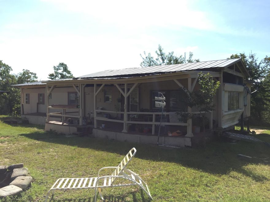 Country Living at its best!  Plenty of room to roam on these 6.71 acres. Nice tarter home or plenty of room to build a new home.