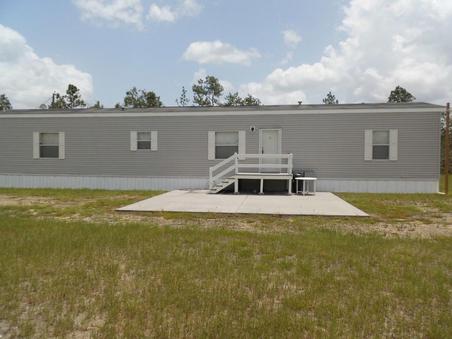 iF YOUR LOOKING FOR A PLACE IN THE COUNTRY THIS IS IT. 3.49 ACRES TO DO WHAT YOU LIKE. PRIDE OF OWNERSHIP  SHOWS  IN THIS WELL KEPT HOME. LOVELY 2 BEDROOM /2 BATH COMES WITH SOME FURNITURE. HAS LARGE WORKSHOP 11X20.