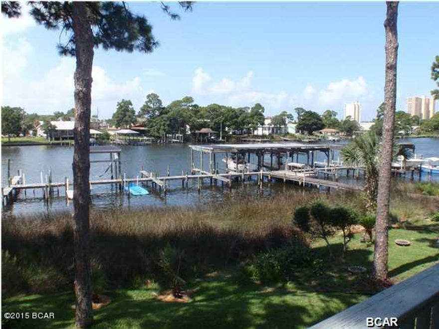 Waterfront townhouse with a boat slip and lift, located along N. Lagoon Drive.  This end unit consists of 2 bedrooms/2-1/2 baths. The list price is based on seller renovating the unit. If you would prefer to make your own renovations, the list price is $235,000. Wonderful lagoon views!  Small community with a common area pool.  Close to restaurants, shopping and schools. REO/foreclosure.  Room dimensions are approximate.  Please measure, if important.