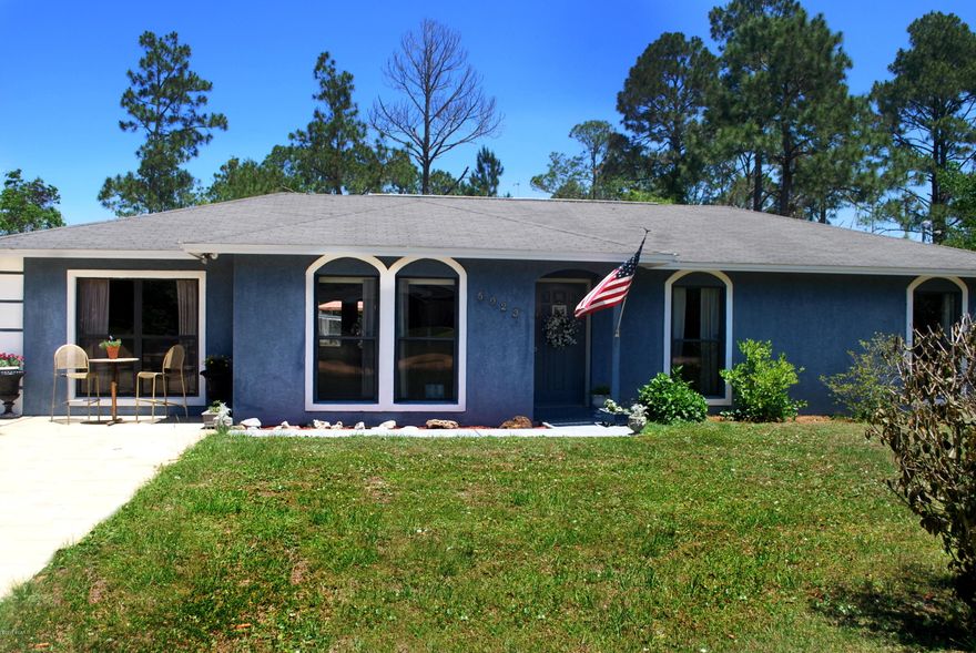 Charming three bedroom, two bath home with a large landscaped yard centrally located and great price!  The  backyard patio with concrete decking is perfect for entertaining outdoors. This home has an open living, dining, kitchen concept with room for an office or flex room.  Interior flooring, granite counter tops in kitchen, new vanity fixtures and Italian marble in main bathroom and freshly painted indoors are many of the recent updates.  Plenty of room for RV/boat parking in the front on one-half of an acre with a garden already there!  Come see this affordable home today!