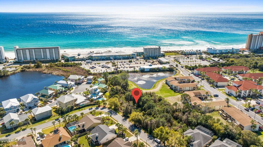 Don't miss the chance to build your dream coastal retreat and wake up to breathtaking Gulf views from one of the last remaining premium lots in the Summer Breeze community. Imagine relaxing on your future balcony, taking in the stunning Gulf visible from approximately 20 feet of elevation. Offering the perfect backdrop for sunrise coffees and sunset evenings.

This exceptional homesite is made even more desirable by the HOA-owned land to the south. Helping preserve your view and adding privacy. With low HOA fees and underground utilities already in place, you'll enjoy both convenience and peace of mind.

The seller also has house plans available for a thoughtfully designed 3-bedroom, 2-bath home, giving you a head start on building your ideal beach getaway.

Ideally located just moments from Beach Access 66, you'll have quick and easy access to the sugar white sands and emerald waters. Plus, you're only a short drive from the shopping, dining, and entertainment options of Pier Park.

Opportunities like this are rare! Secure one of the last lots in Summer Breeze and start building your coastal lifestyle today