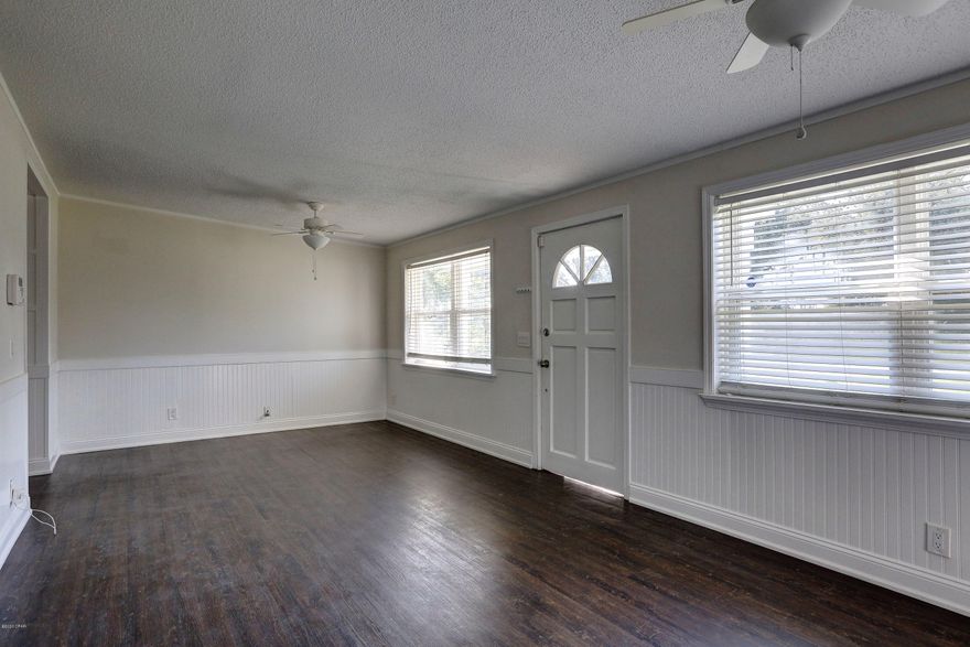 You'll love this move in ready 3 bed 1 bath concrete block home.  Features include metal roof, updated AC, updated windows, large lot, luxury vinyl plank flooring, updated painting and stainless appliances.  There is an indoor laundry/utility room and a small deck off the back.  Come see it today!