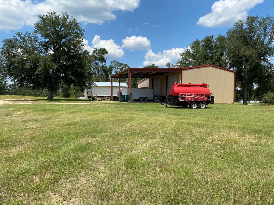 Come check out this 65 x 31  shop on Hwy 90 in Grand Ridge. It's less than 9 miles from Marianna.  The acreage accuracy is pending a survey. Sellers are dividing the parcel.  It will sit on 2 +- acres. Steel I beams, 40x25 canopy, 15x12 shed and a 36x18 office with a conference room and a half bath. It has a renter and already generates an income each month, on a month to month basis. Great location for a business!!
