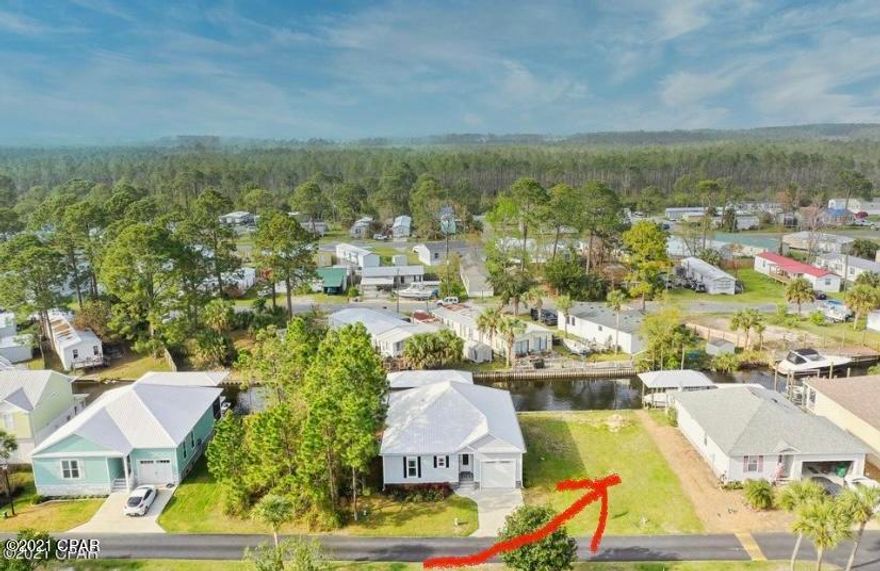 Rare waterfront lot! Perfect place to build your own dockside home on a deep water canal in Panama City Beach!! This lot is cleared and ready to build with NO bridges to restrict your boat access to the Bay and Gulf of Mexico. Just west of the Hathaway Bridge. Harbour Towne subdivision is a gated community with a pool and amenities. Close to the Navy Base, shopping, churches, state parks and the Worlds Most Beautiful Beaches.