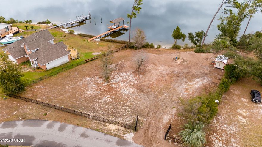 WATERFRONT with Gulf access!! 

Here's your chance to pull your boat up to your home--just bring your own dock!! 

Rare opportunity to secure what appears to be the last remaining vacant waterfront homesite on Hugh Dr. with direct frontage on Callaway Bayou—a protected, boatable waterway that connects out to the Intracoastal system and on toward St. Andrews Bay/Shell Island and the Gulf beyond.  

The lot is ready for your vision—bring your builder and design the custom waterfront home you've been waiting for. An existing well is on site (verify to buyer's satisfaction), and the waterfront configuration is ideal for those who want to create a private dock and keep a boat close to home. The water depth in this area is known for dropping off relatively quickly, which is a major advantage for boaters (all dock construction subject to applicable permits/approvals).  

If you've been waiting for a buildable waterfront lot with genuine boating potential—not just a 'view' lot—this is the one to see. Buyer to verify all details important to them, including utilities/well condition, setbacks, flood zone, shoreline/dock permitting, and any HOA or municipal/county restrictions.

The closest publicly advertised waterfront vacant-lot alternatives I could confirm were instead in the gated communities--here you may have more privacy, control over decision making for your land, and acreage (w/ nearby comps as of listing date).