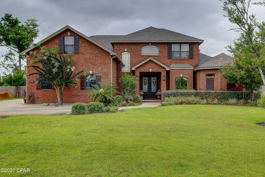 College Point Custom Builder Owned Home with all the custom upgrades.  This beautiful brick pool home features hand scraped hardwood floors throughout the first level offering elegant foyer and staircase, chef's kitchen with gas stovetop and decorative hood, living room with fireplace, formal dining room, office, large master with morning kitchen, and walk-through shower room, office and oversized garage.  Second level offers three bedrooms,  two baths, family den and movie room.  Exterior offers pool, large covered porch and outdoor kitchen area.  See documents for list of all this homes features.  All ages, sizes and descriptions must be verified by the buyer.