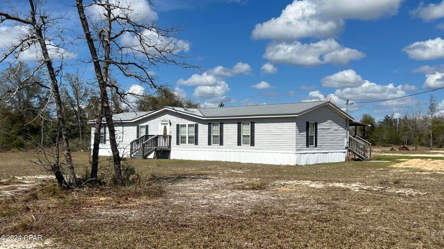 CURRENTLY UNDER CONTRACT, SELLER WILL CONSIDER BACKUP OFFERS Plenty of room to run and ride the 4 wheelers with this 4 Bedroom, 2 bath mobile home on 5 acres! This 2005 mobile home offers an open concept with a split bedroom floor plan. The home has a covered deck over looking the yard to see the kids playing in the yard. In addition to the home there is a shop out back for extra parking or projects. The perimeter of the property has been fenced except the left side of the property. However, some fencing may need to be mended. A must see to appreciate. The sellers are open to negotiations and are open to all reasonable offers. All measurements are approximate and should be verified by buyer if important.