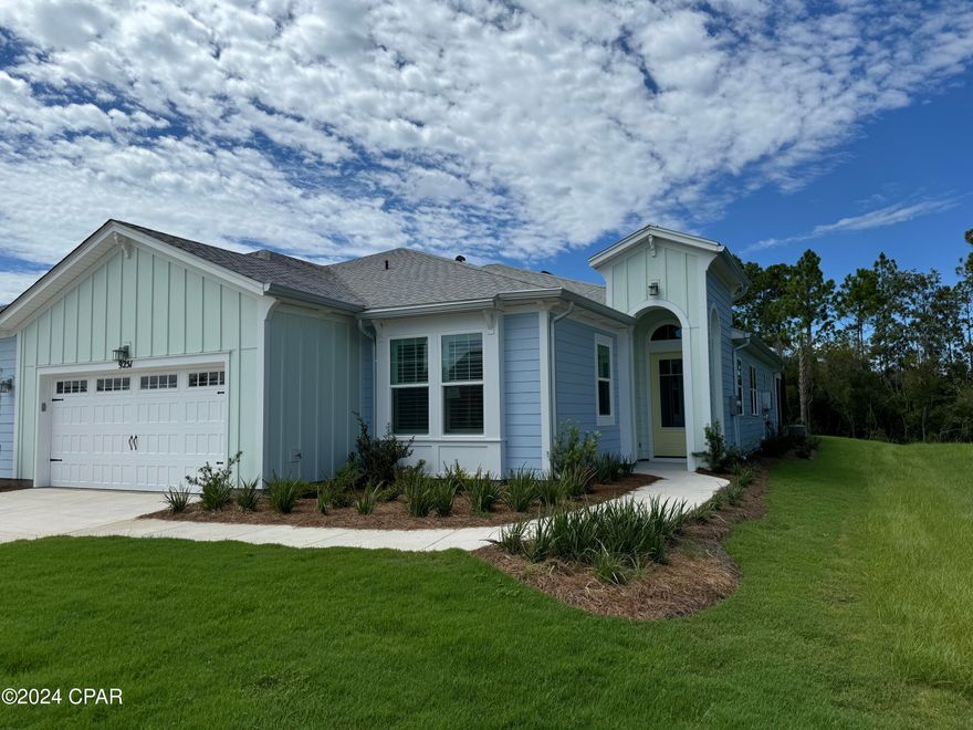 Gorgeous Barbuda Bay model home with beautiful preserve and pond view in Latitude Margaritaville Watersound. A gated active adult 55+ community. Breathtaking sunsets from the extended screened-in lanai. 2 bedroom 2 bath with den. Granite countertops, laminate flooring, impact glass entry front door, impact windows , 8'' doors, pull-out kitchen shelving, soft close, pots and pan drawer, under cabinet lighting, Level 3 kitchen cabinets with crown molding, recessed lighting, zero entry master shower.  2-10 year transferable warranty. Amazing Amenities include a private restaurant with 3 bars, resort style pool, live music daily, pickleball, tennis, bastketball, bocce ball, cornhole, putting green and a band shell for live music. Fins Up Fitness Center, indoor lap pool and whirlpool.  Fun lifestyle staff creating many activities for fun! Phase 2 of the amenities has broken ground and includes a full size theatre, Barkaritaville dog spa, woodworking shop, business center and community rooms for clubs, groups, tastings and food demonstrations. The public retail has also begun with the golf cart store and a bank is about to open.  Coming soon will be a grocery store, restaurants and other boutique shopping as well as the Public Marina.