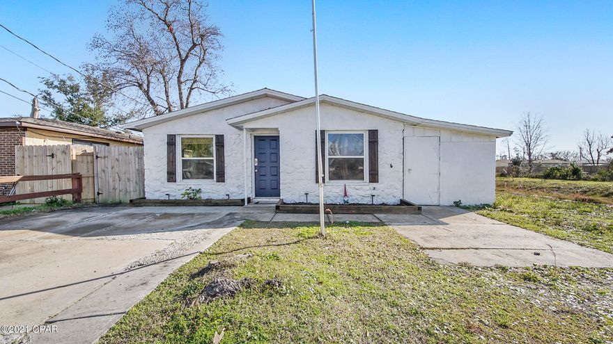 CURRENTLY UNDER CONTRACT, SELLER ACCEPTING BACKUP OFFERS Cute 3 bedroom/2 bath home located close to Tyndall Air Force Base. Open floor plan with wood burning fireplace, spacious kitchen, breakfast bar, dining area and LVP flooring throughout. Additional bedroom has sliding glass door that leads to large fenced in backyard with wood deck. Attached storage. This is a must see.