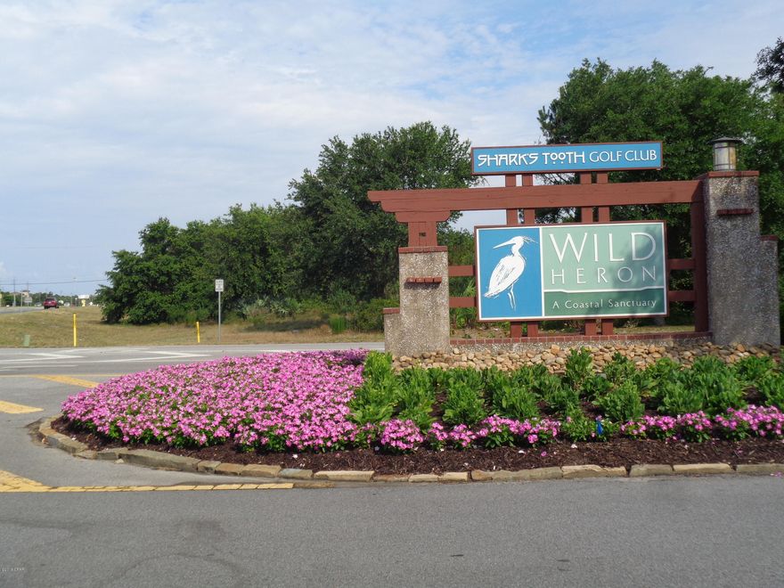 Very large, beautiful residential lot in the gated resort community of Wild Heron.  Greg Norman's 'Shark's Tooth' golf course, tennis, club and more.  Wild Heron is located on the western end of Panama City Beach, close to shopping, restaurants, beaches, Northwest Beaches Airport, and Scenic 30-A.  Probable water views. ***Buyer is responsible for personally verifying details about this property.  Any information contained in this listing is believed to be accurate but is not guaranteed.***