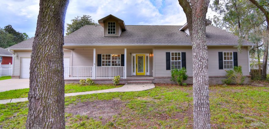 This gorgeous freshly painted 3 bedroom, 2 bath home is located on a large lot with brand new floors throughout! Living room has a fireplace and french doors leading to the Florida room. Kitchen features ample cabinetry, granite countertops, and stainless steel appliances. Master bedroom has new carpet and an en suite with double vanity, jacuzzi tub, separate titled shower, and his and hers walk in closets. There are 2 other spacious bedrooms and a guest bath with built ins. Laundry room has a utility sink. Florida room overlooks the approx 3/4 acre, private backyard with a 23x30 workshop. Just minutes to town and 1 block from the boat launch at Deer Point Lake!! All sizes/info/measurements are approx, please verify if important.