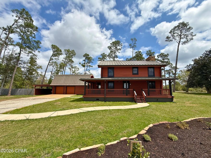 Rare opportunity to own a true log cabin situated on two private acres while still being conveniently located near everyday essentials. The horseshoe driveway with dual entrances adds both convenience and curb appeal, and the property is ideally positioned close to schools, Deerpoint Lake, nearby boat ramps, the beaches, and all your daily activities.

This property offers exceptional versatility with a large detached garage/workshop fully equipped with electricity, perfect for hobbies, storage, or business use. An added bonus is the detached efficiency apartment/suite, complete with a full kitchen, full bathroom, and spacious living area--ideal for guests, extended family, or potential rental income.

Inside the two-story home, you'll find a spacious, updated kitchen featuring granite countertops, new cabinetry, and stainless steel appliances that flow seamlessly into the formal dining room. The large great room showcases a cozy fireplace, creating a warm and inviting atmosphere, along with an updated half bath conveniently located on the first floor.

Upstairs, the primary suite offers a private retreat, complete with its own fireplace for relaxing evenings, a private en-suite bathroom, separate makeup vanity, and recessed ceilings. Two additional bedrooms also feature recessed ceilings, along with the convenience of a large attic space with dedicated access for additional storage.

Outdoor living is just as impressive. You'll love the covered front porch that wraps nearly all the way around the home, along with a spacious back deck overlooking the fully fenced backyard. The fire pit area creates the perfect setting for gatherings, entertaining, and enjoying peaceful country evenings.

Additional highlights include a New HVAC system. New hot water heater, Freshly stained log exterior, New roof (2022), Beautifully updated landscaping, Fully fenced privacy yard

With its unique character, functional layout, income potential, and acreage, this property truly combines the charm of country living with the convenience of being close to everything.