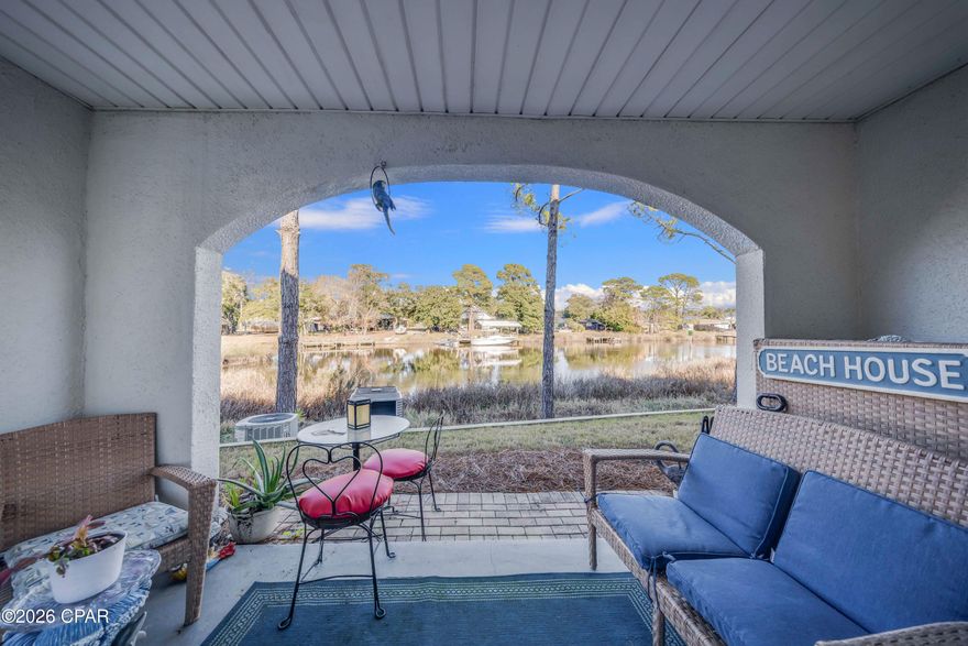 Waterfront, bottom-floor condo on the lagoon of St. Thomas Square in Panama City Beach, FL.  Yes, this South Lagoon water spot takes you directly to the Gulf for deep-sea fishing or a relaxing visit to Shell Island. Sit on your back patio, overlooking this waterfront. (Look at this view.....all views are not the same) Enjoy fishing from your back door or launch your boat & store it right here. Don't forget the pool & tennis courts. If you're looking for a short term, rental income producing property, this is it. Located in the middle of Thomas Dr. where all of the action is but a security gate  for your privacy. 
This complex has a Commercial strip outside the gates, with restaurants, a winery & more. St. Thomas Sq. is also within walking distance of the Beach (with handicapped accessible access), and there are more restaurants nearby. (Mexican, Big Easy, Hammerhead Fred's, Wendy's, Pizza, Ice cream) & Nashville's Tootsie's opening in Spring.