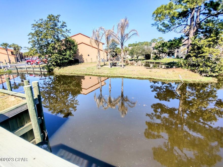 CURRENTLY UNDER CONTRACT, SELLER WILL CONSIDER BACKUP OFFERS ~ Move In Ready ~ GOLF CART INCLUDED ~ Looking for a unit that OVERLOOKS the CANAL and only a 3 Minute STROLL to the BEACH ~ Come check out the 2 Bedroom unit in the Gated Resort of Gulf Highlands Beach Resort. Each Bedroom has its own PRIVATE BATHROOM. The Downstairs has plenty of room for ENTERTAINING. The Kitchen has an extra long BAR that could seat 6 people. You will love hanging out at ''HAPPY HOUR'' on the DECK overlooking the CANAL. The Resort Amenities... 11 Pools ''5 Heated'', 4 Tennis Courts / Pickleball '' 2 Lighted'', Fitness Center, 18 Hole Mini Golf, 2 Playgrounds, Shuffleboard Courts, Conference Center, and a Private Club House  Selling Mostly Furnished + Linens, Towels, Kitchen Stuff. (closed for renovations) with Snack Bar on The Beach along with 1 of the 11 Pools.