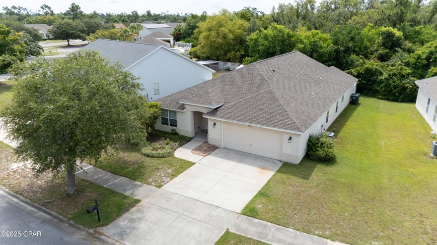 PRICE REDUCTION AND SELLER SAYS BRING AN OFFER!! This beautifully maintained home offers 3 bedrooms, 2 full baths, a formal dining room, dedicated office/den, laundry room, and a 2-car garage — thoughtfully designed for both everyday living and entertaining. The open floor plan creates a seamless flow, allowing the kitchen to remain the heart of the home, perfect for staying connected while cooking or hosting. The spacious primary suite offers a peaceful retreat with direct access to the screened patio — ideal for morning coffee or evening relaxation. The backyard is designed for easy, low-maintenance living, making it perfect for those who value outdoor enjoyment without extensive upkeep. If you're looking for a forever home, this one checks all the boxes. Quality, tranquility, and city living at its finest. The community is amazing, golf cart friendly with a large enticing pool and a pavilion just a few steps from your front door. Located in desirable Lynn Haven and close to military bases, shopping, restaurants, and entertainment. The Seller has a viable survey. Call today to schedule your showing! All information is deemed reliable and measurements are approximate; both should be verified by Buyer. Refrigerator and kitchen stove will not transfer.