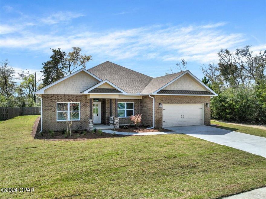 Discover the epitome of luxury living in the sought-after Grant's Mill community, just moments away from the convenience of the new Publix. This stunning residence, meticulously crafted by CM Builders with quality 2 x 6 construction, awaits its lucky new owners with a plethora of desirable features and finishes.

As you step inside, you're greeted by an inviting atmosphere enhanced by the spaciousness of the large covered back porch and expansive yard. The exterior boasts enduring James Hardie siding, a water-resistant zip sheathing system, and a GAF Timberline HDZ shingle roof, ensuring both beauty and durability for years to come. With Trane HVAC system, hurricane impact windows and doors, and structural hurricane clips, safety and comfort are paramount, all while potentially lowering insurance costs thanks to its flood zone X designation.

Entertain with ease in the sprawling great room, which seamlessly integrates a generous kitchen, large eating area, and expansive living room. For more formal gatherings, the separate dining room provides a versatile space that can easily adapt to your lifestyle needs.

The kitchen exudes both style and functionality, featuring quality shaker-style cabinets with soft-touch drawers, complemented by luxurious Dallas White granite countertops. Whip up culinary delights with top-of-the-line Whirlpool stainless appliances and a convenient natural gas range. Luxury abounds throughout the home, with rigid core Luxury Vinyl plank flooring offering both style and durability, while ceramic plank tile adorns the full bathrooms. Retreat to the palatial master suite, complete with a tranquil soaking tub, custom decorative tile shower, and premium Delta plumbing fixtures. The master closet conveniently connects to the well-equipped laundry room, making household chores a breeze.

With spacious bedrooms throughout, including one with a full bathroom en suite, there's ample space for rest and relaxation for the whole family. Brushed nickel plumbing and electrical fixtures add a touch of sophistication, while the neutral color scheme of grey tones accented by crisp white trim creates a timeless backdrop for your personal style.

Complete with an oversized 2-car garage with side door access to the yard, this exquisite home offers the perfect blend of luxury, comfort, and convenience. Don't miss your opportunity to make this remarkable property your forever home!