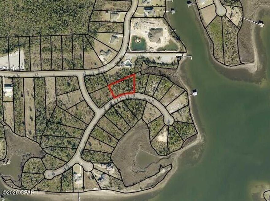 Spectacular home site in the desirable Laird Bayou community. At over .70 of an acre, there is plenty of space to build your dream home. It backs up to the common area making it more private and giving great proximity to the amenities.  Laird Bayou is a gated waterfront community with beautiful custom homes. Ribbon curbed streets and underground utilities. Amenities include a Pool, Boat Launch with Day Dock and RV & Boat Storage. They recently added a high-end fish cleaning station on the dock. Just clean your catch right there! Great proximity to TAFB and Mexico Beach. East Bay is home to some of the best flats fishing in the state and just a short boat ride to the Gulf of Mexico. Schedule your private tour of Laird Bayou today!