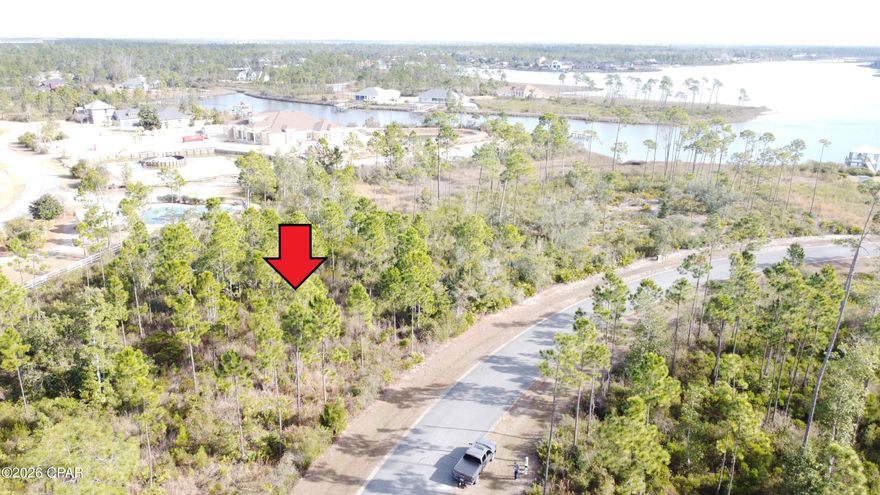 Spectacular home site in the desirable Laird Bayou community. At over .70 of an acre, there is plenty of space to build your dream home. It backs up to the common area making it more private and giving great proximity to the amenities.  Laird Bayou is a gated waterfront community with beautiful custom homes. Ribbon curbed streets and underground utilities. Amenities include a Pool, Boat Launch with Day Dock and RV & Boat Storage. They recently added a high-end fish cleaning station on the dock. Just clean your catch right there! Great proximity to TAFB and Mexico Beach. East Bay is home to some of the best flats fishing in the state and just a short boat ride to the Gulf of Mexico. Schedule your private tour of Laird Bayou today!
