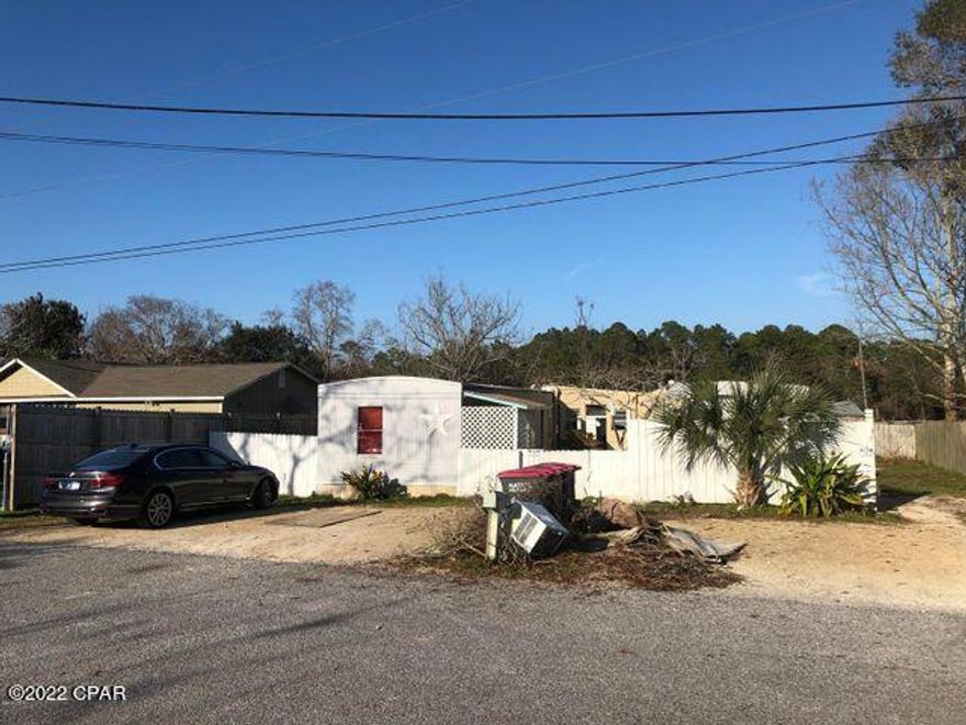 Build Your New Home! 70x125 Lot available on the West side of Panama City Beach (Laguna Beach). BRAND NEW CONSTRUCTION NEXT DOOR! There currently is mobile homes on the lot being cleared next week. Existing Septic tank on the Lot. All utilities available. Drive by and see the Location! Short drive to the Beach. Also grocery stores, Dollar General and convenient stores.