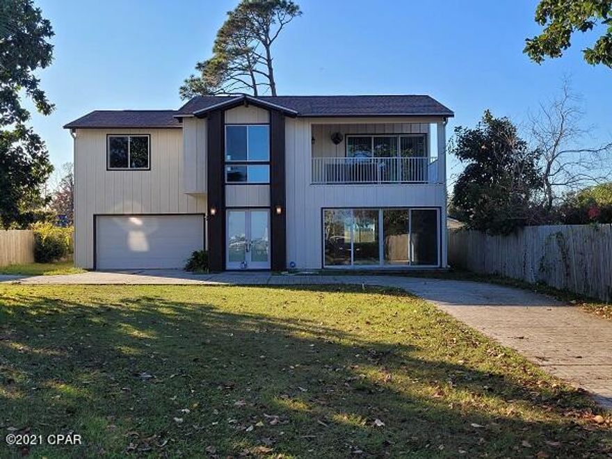 Bay View!  3 bedroom 2.5 bath two story home with garage.  Home offers custom cabinetry, stainless steel appliances, granite countertops, tile and carpet flooring.  Upstairs includes 3 bedroom, 2 full baths and laundry room.  The master bedroom features a balcony with view of the bay.  Lawn care is included!  Lot in front of the house does not convey with the property.