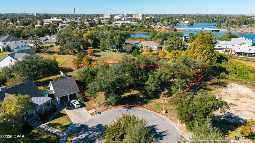 Build your dream home in one of Panama City's most sought-after neighborhoods—Cove Pointe! This spacious .48-acre homesite sits on a quiet cul-de-sac and captures breathtaking views of Watson Bayou. Imagine mornings with sparkling water just beyond your front door and evenings filled with the glow of North Florida sunsets.

Cove Pointe offers a relaxed coastal lifestyle with the convenience of a community day dock only a short walk away—perfect for launching your paddleboard, casting a line, or simply watching the boats drift by. From here, you're just a golf-cart ride to downtown Panama City's revitalized waterfront district, where you'll find fabulous local restaurants, music venues, art galleries, and boutique shopping.

Enjoy the best of both worlds—quiet, upscale living on the bayou and quick access to the St. Andrews Bay Yacht Club, marinas, and all the charm that makes the Cove community so beloved.

Come see why life at Cove Pointe is where Panama City's coastal heritage meets modern luxury.