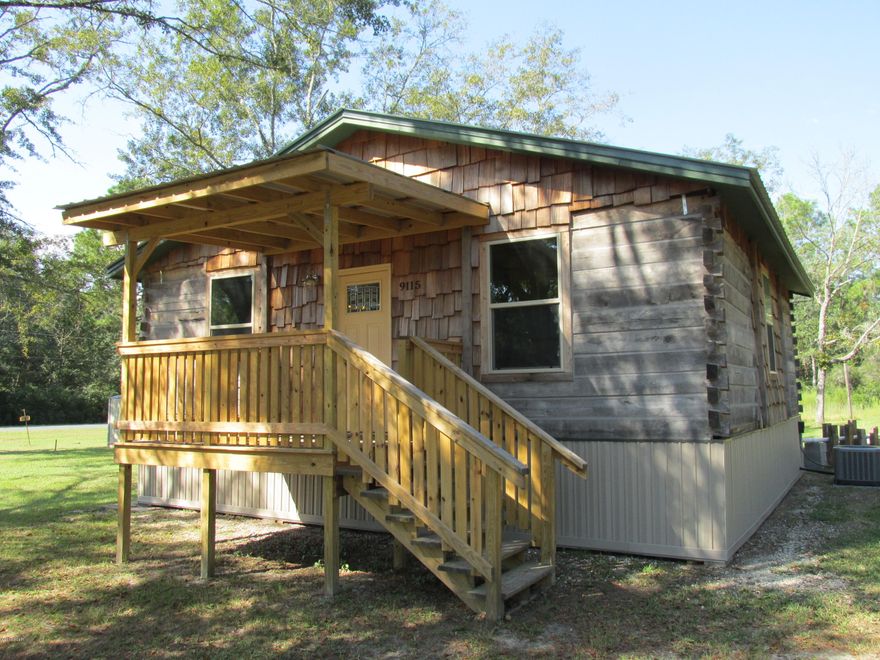 So Unique! Brand New Log Cabin on pretty 1 acre corner lot on paved road.  This rustic cabin was built with modern, elegant & upgraded features and should not be missed.  This is a super special property.  Open concept floor plan.  Inside are beautiful wood ceilings, wood walls & lovely flooring, custom trim.  The Kitchen is fully equipped with stainless appliances, has a functional island with granite top, also a large pantry closet off Kitchen.  Workshop/Garage in back yard is 24x24 with over head door.  Pretty 145x300 lot has stately oak trees and is at the corner of two paved roads in a very quiet Deerpoint neighborhood.  Call today!!! Don't Wait!