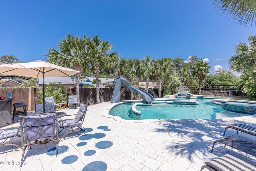 'CURRENTLY UNDER CONTRACT, SELLER WILL CONSIDER BACKUP OFFERS' 

Welcome to this incredible ONE-OF-A-KIND, SHORT-TERM RENTAL OASIS with a custom ISLAND STYLE POOL!

This incredible turn-key, fully furnished short-term rental is a rare find — boasting 5-star reviews, no HOA or deed restrictions, and bookings nearly filled in 2025!


A ONE-OF-A-KIND PROPERTY:

Set on an oversized parcel combining two expansive lots, this property is a standout in the high-demand South Lagoon investor market.  The showpiece of the estate is a custom-designed, island-style pool shaped like a giant fish, complete with a Jacuzzi, swim-up bar, water slide, and an outdoor tiki bar and grill.  By night, the LED-lit pool transforms into a light and water show — an unforgettable space for guests and owners alike.


SPACIOUS & STYLISH LIVING:

The three-story, 4-bedroom, 3.5-bath home offers spacious, modern living areas and a seamless flow between indoor and outdoor entertaining.  The ground-floor heated and cooled game room is a guest favorite, featuring a pool table, TV, games, and more — ensuring repeat business and happy visitors year after year.


INCOME & INVESTMENT POTENTIAL:

This property consistently generates $100,000-$200,000 in gross annual rental income, with even greater potential depending on personal use and booking availability.  With no HOA restrictions, you're free to make this your private high-yielding rental retreat! 


ADDED PERKS: 

Behind the pool is a gated area with separate road access — perfect for storing an RV, boat, jet skis — OR — Building a separate 1-2 Bedroom Rental to generate even more Income!  Its prime location places you minutes from boat ramps, Shell Island, St. Andrews State Park, the Gulf of Mexico, and all the local attractions, dining, and entertainment Panama City Beach is famous for.

Don't Miss This Rare Opportunity!

Schedule your private showing today and experience this South Lagoon paradise.