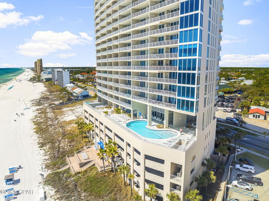 Looking for 30A-inspired living in Panama City Beach? Look no further than Palazzo 207—a beautifully updated 3-bedroom, 3-bathroom Gulf-front condo that combines luxury, comfort, and convenience in one exceptional package. Ideally situated just yards from the second-floor fitness center, this unit has been thoughtfully reimagined from front door to balcony. As you enter, you're welcomed by a striking combination of tile and Bella Cera luxury wood floors that guide you through the open, light-filled space. Floor-to-ceiling windows draw your gaze to the balcony, where expansive Gulf views create the perfect backdrop for coastal living.
The layout is as functional as it is stylish. One guest suite offers a private en suite bath—perfect for visitors. While a second bedroom features a trundle bed for additional flexibility. A reimagined storage area with frosted glass doors adds a modern, practical touch. The kitchen is a true showpiece, featuring white shaker cabinetry with soft-close doors and drawers, double-thick granite countertops, a farm-style sink, and high-end stainless steel appliances, including a GE WiFi-enabled cooktop and oven. There's even a Whirlpool trash compactor for added convenience.
Adjacent to the kitchen, a recessed beverage center with a Danby Silhouette dual-door fridge is perfect for entertaining. The dining area showcases a solid wood table and chairs, while the living space invites relaxation with its leather sectional and custom floating media shelving beneath a mounted 65'' TV. The primary suite is a serene retreat, complete with a king-size bed, padded headboard, solid wood furnishings with soft-close drawers, and breathtaking Gulf views. The en suite bathroom has been completely redesigned to include a double vanity and a spacious corner shower with both side and waterfall showerheads. A tucked-away laundry center with LG washer and dryer adds everyday convenience.
To top it all off, this unit includes a private storage closet, making beach life even easier. With its ideal location, tasteful updates, and elegant coastal charm, Palazzo 207 is the perfect opportunity for a primary residence, second home, or luxury rental. Schedule your private showing today and experience the best of Gulf-front living.